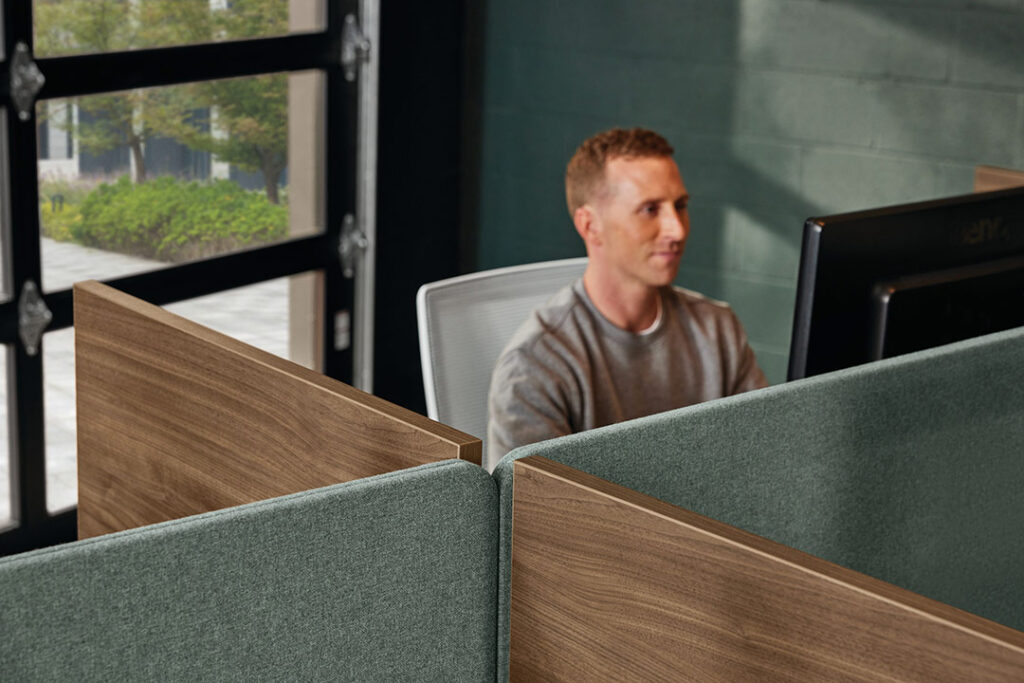 Man seated and working.
