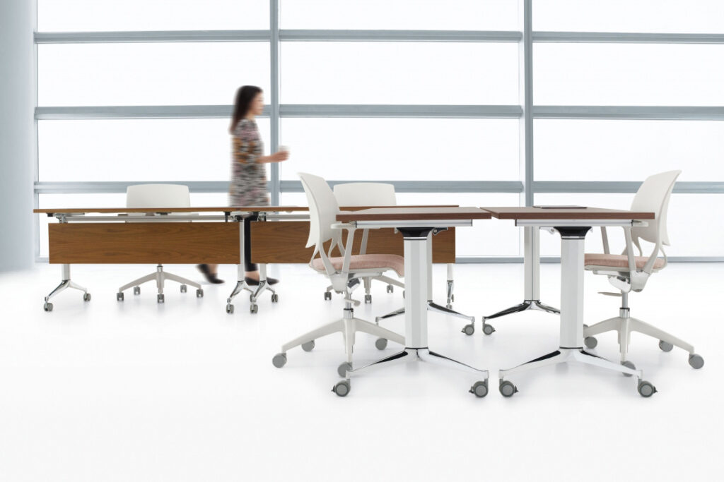Desks set up in a large, open workspace